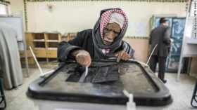 An Egyptian man casts his vote during a referendum on the new Egyptian constitution at a polling station on December 15, 2012 in Cairo, Egypt. Source: edition.cnn.com